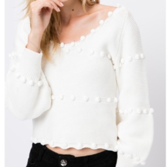 white pom pom sweater